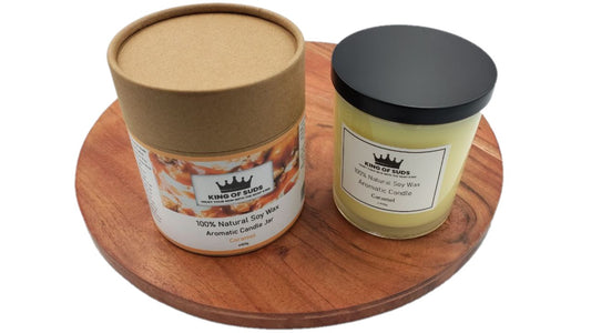 Candle Jars, with white or black lid, on a round wooden surface with a white background