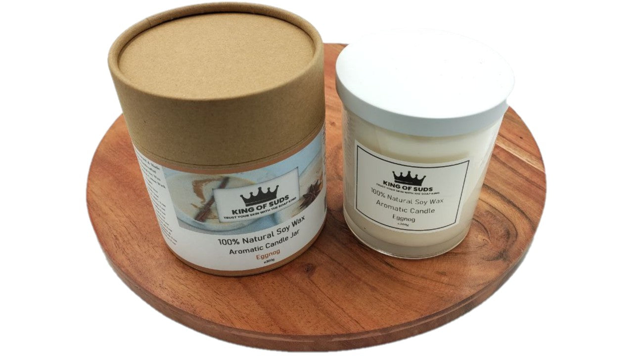 Candle Jars, with white or black lid, on a round wooden surface with a white background