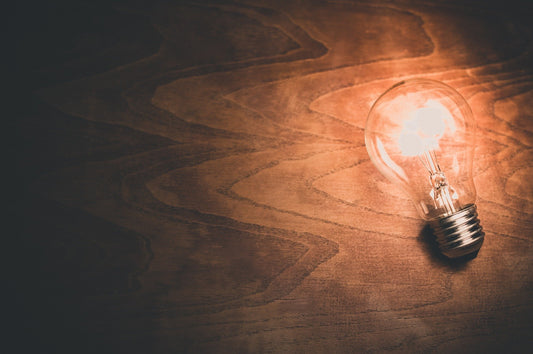 Light bulb light up laying on a wooden surface