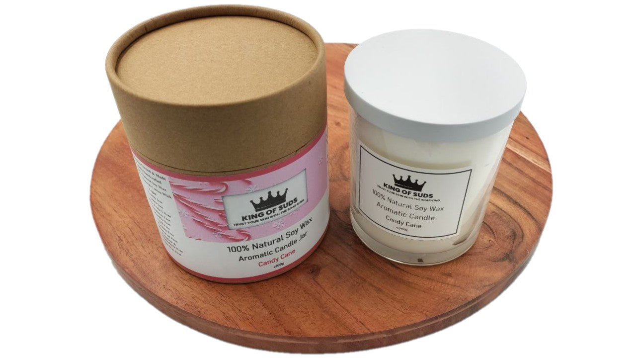 Candle Jars, with white or black lid, on a round wooden surface with a white background