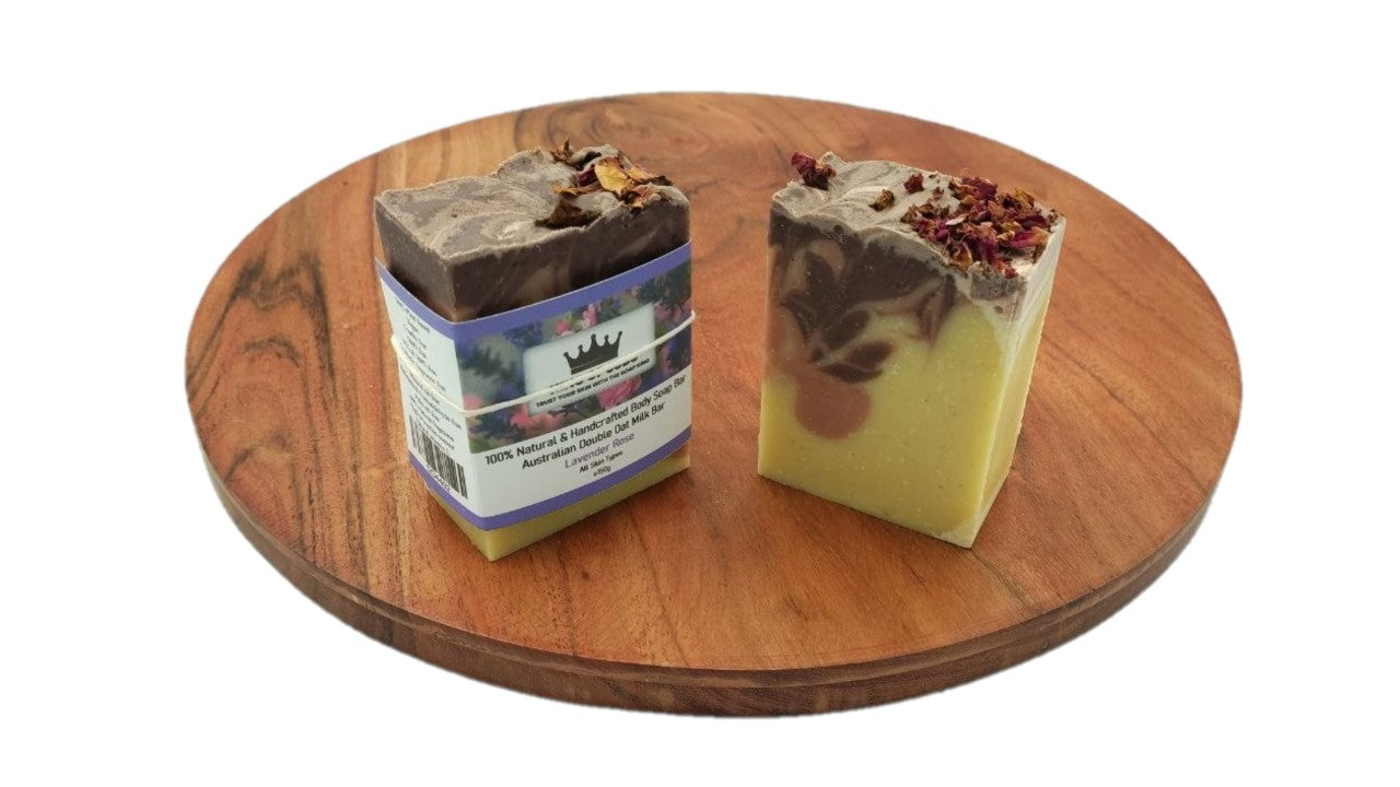 Two soap bars on a wooden turntable with a white background