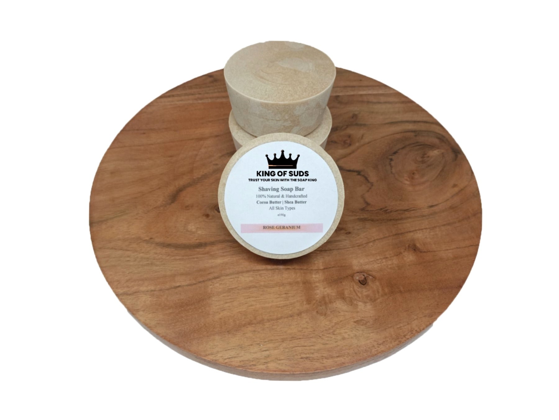 Bar of soap on a wooden stand with a label on a white background
