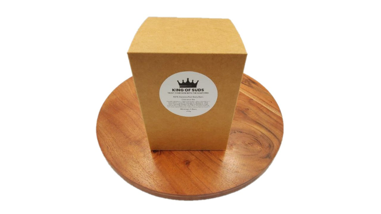 Wooden box with a label on a wooden stand against a white background